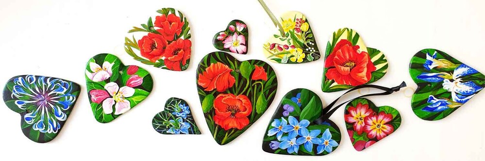 Selection of hand crafted and painted clay hearts