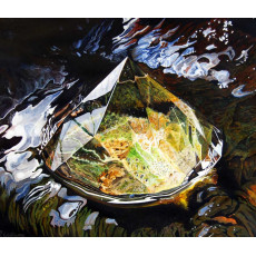 A crystal placed in a small stream highlighting reflections